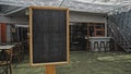 Black empty old chalk board standing indoors Royalty Free Stock Photo