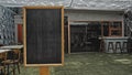 Black empty old chalk board standing indoors Royalty Free Stock Photo
