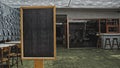 Black empty old chalk board standing indoors Royalty Free Stock Photo