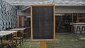 Black empty old chalk board standing indoors Royalty Free Stock Photo