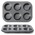 Black empty pan for cupcakes isilated on white background / top Royalty Free Stock Photo