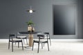 Black empty poster on black wall in modern dining room with round table and black wooden chairs on ceramic tiles floor. Mockup Royalty Free Stock Photo
