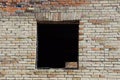 Black empty window on old brown brick wall Royalty Free Stock Photo