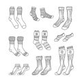 Black engraved socks drawing. Winter warm Christmas stockings set in ink hand drawn style vector illustration Royalty Free Stock Photo