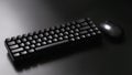 Black ergonomic computer keyboard and computer mouse on a dark background. Wireless technology and gadgets. Minimalism. Diagonal. Royalty Free Stock Photo