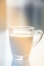 Black espresso coffee with heady froth in a glass mug or cup, light toning Royalty Free Stock Photo