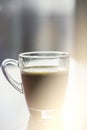 Black espresso coffee with heady froth in a glass mug or cup, light toning Royalty Free Stock Photo