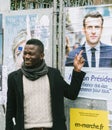 Black ethnicity man showing support to Emmanuel Macron