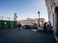 Black ethnicity people on the stairs with Gare de L'est train station in the