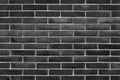 Black exposed brick wall background texture without plaster - concept image Royalty Free Stock Photo