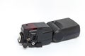 Black external flash for a camera with open additional connectors. Royalty Free Stock Photo