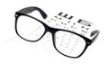 Reading glasses on eye chart Royalty Free Stock Photo