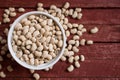 Black eyed beans in bowl on wooden background