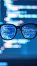 Black eyeglasses reflecting glowing blue computer code on a dark background Royalty Free Stock Photo