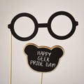 Black eyeglasses and text happy geek pride