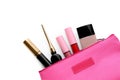 Black eyeliner and other makeup products in cosmetic bag on white background, top view Royalty Free Stock Photo