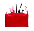 Black eyeliner and other makeup products in cosmetic bag on white background, top view Royalty Free Stock Photo