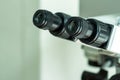 Black eyepieces of the microscope in the laboratory for viewing small items. Close-up. Royalty Free Stock Photo