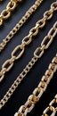 A black fabric background is layered with multiple gold and silver chains Royalty Free Stock Photo