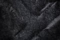 Black fabric canvas silk texture background. Abstract closeup detail of textile material wallpaper. X cross shape emboss Royalty Free Stock Photo
