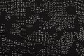 Black fabric with shiny reflective sequins Royalty Free Stock Photo