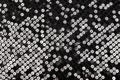 Black fabric with shiny reflective sequins Royalty Free Stock Photo