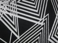 Black fabric texture with angular white lines