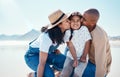 Black family, children and beach with parents kissing their daughter outdoor in nature on the sand by the ocean. Kids Royalty Free Stock Photo