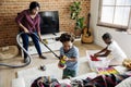 Black family cleaning the house together Royalty Free Stock Photo