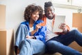 Black Family Couple With Digital Tablet And Credit Card Choosing Furniture Online Royalty Free Stock Photo