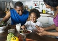 Black family eating healthy food together Royalty Free Stock Photo