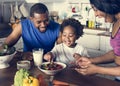 Black family eating healthy food together Royalty Free Stock Photo