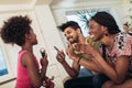 Black family enjoy singing karaoke