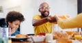 Black family, food and parents with children for breakfast, lunch and eating together in home. Happy, serving and dad Royalty Free Stock Photo