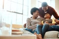 Black family, happy and relax on sofa with boy and parents, hug and laughing in their home together. Happy family Royalty Free Stock Photo