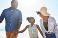 Black family, happy and walking on a beach with child or kid on vacation or holiday at the ocean or sea. Travel Royalty Free Stock Photo