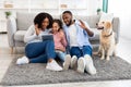 Black family having videocall using laptop waving hands Royalty Free Stock Photo