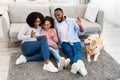 Black family having videocall using laptop waving hands Royalty Free Stock Photo