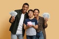 Black family holding money cash and piggy bank Royalty Free Stock Photo