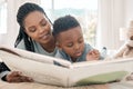 Black family, mother and child reading book for learning, storytelling and bonding. African mom, kid and story time