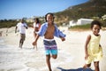 Black family, parents and children or running at beach for adventure, holiday or vacation in summer. African people Royalty Free Stock Photo