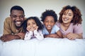 Black family, portrait and relax in bed, happy and smile while bonding in their home together. Face, children and Royalty Free Stock Photo