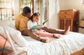 Black family, reading book and bedroom with father and child together for story time. Man or dad and girl together in Royalty Free Stock Photo