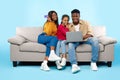 Black family using laptop computer and credit card Royalty Free Stock Photo