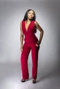 Black fashion model with red pantsuit Royalty Free Stock Photo