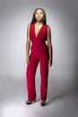 Black Fashion Model with Red Pantsuit Royalty Free Stock Photo