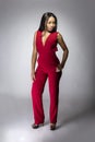 Black Fashion Model with Red Pantsuit Royalty Free Stock Photo