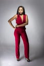 Black Fashion Model with Red Pantsuit Royalty Free Stock Photo