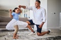 Black father, girl and being happy, dance and have fun together in living room. Dad, young female child and daughter Royalty Free Stock Photo