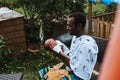 Black father holding his mixed race baby boy Royalty Free Stock Photo